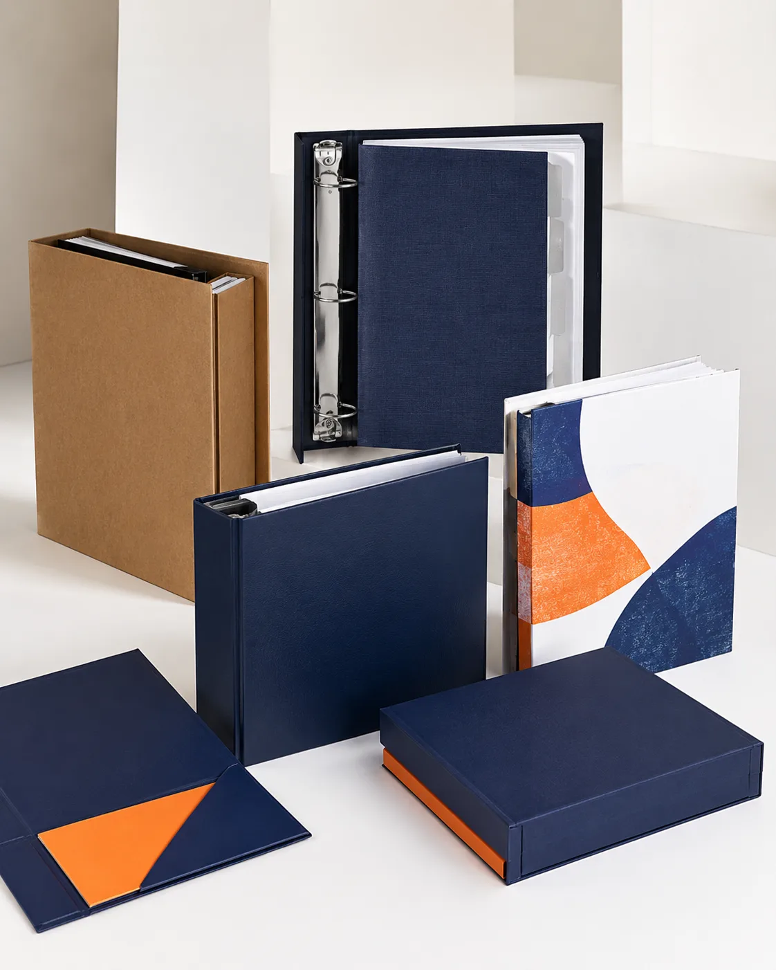 Custom navy and orange binders, folders, and turned edge boxes